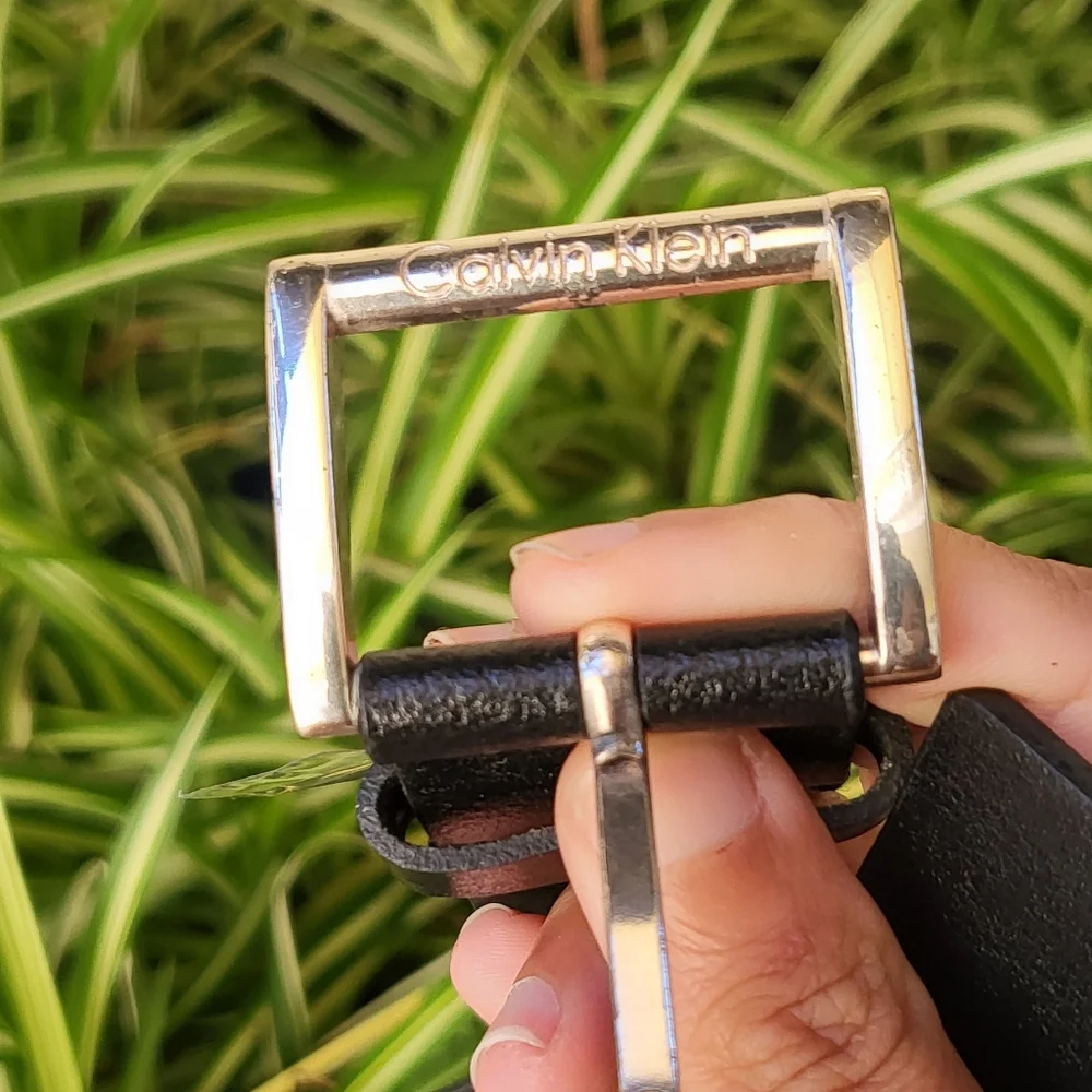 Calvin Klein black leather belt with rhinestone holes